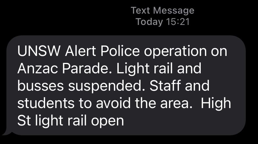 A text message sent at 3:21pm, stating "UNSW Alert Police operation on Anzac Parade. Light rail and busses suspended. Staff and students to avoid the area. High St light rail open"